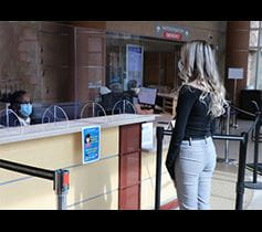 woman checking in for Denver Health clinic appointment during COVID-19