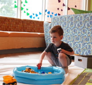 A child plays with toys